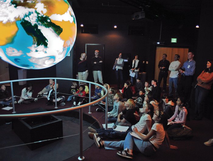 Science On a Sphere (SOS) has the power to captivate students and engage them in Earth and space sciences, as seen with this group of students visiting SOS at the NOAA Earth System Research Laboratory in Boulder, Colo.