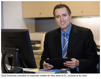 Scott Schulman, president of corporate markets for Dow Jones & Co., at home at his desk.