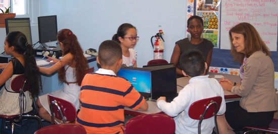 ALA president Sari Feldman (far right) with fourth-grade students and their school librarian.