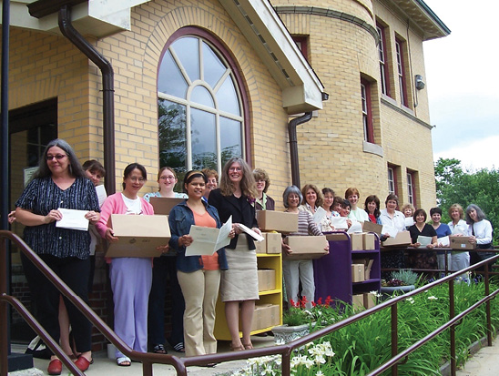 Staffers from a public library the author worked with posed with all of the surveys they were about to send to the masses.